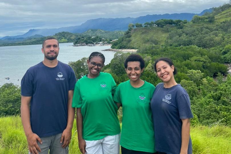 Four EcoScholars in Eda Davara shirts on the hill above Kohua