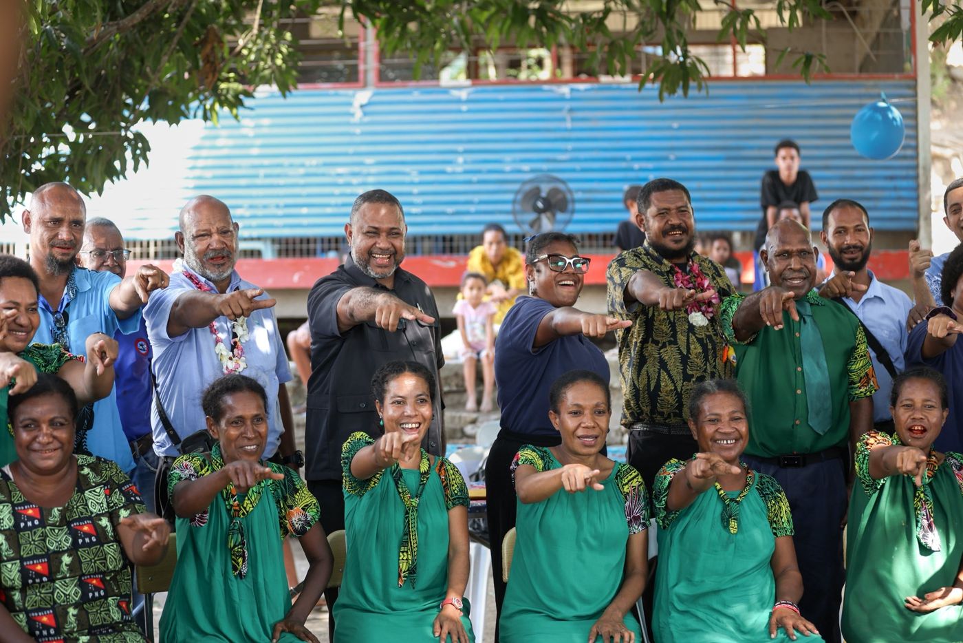 The Member for Hiri-Koiari, Hon. Keith Iduhu, with Eda Davara, teachers and Barakau community members at the 2025 inter-school debate