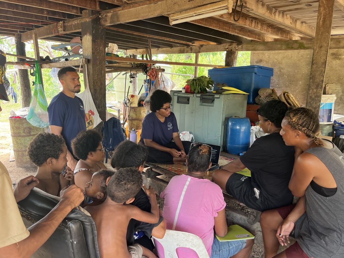 Eda Davara team leading a mangrove nursery workshop with Barakau families under a house